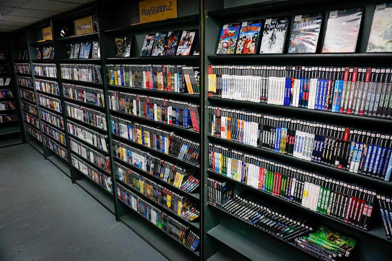 Shelves of PlayStation and Xbox games