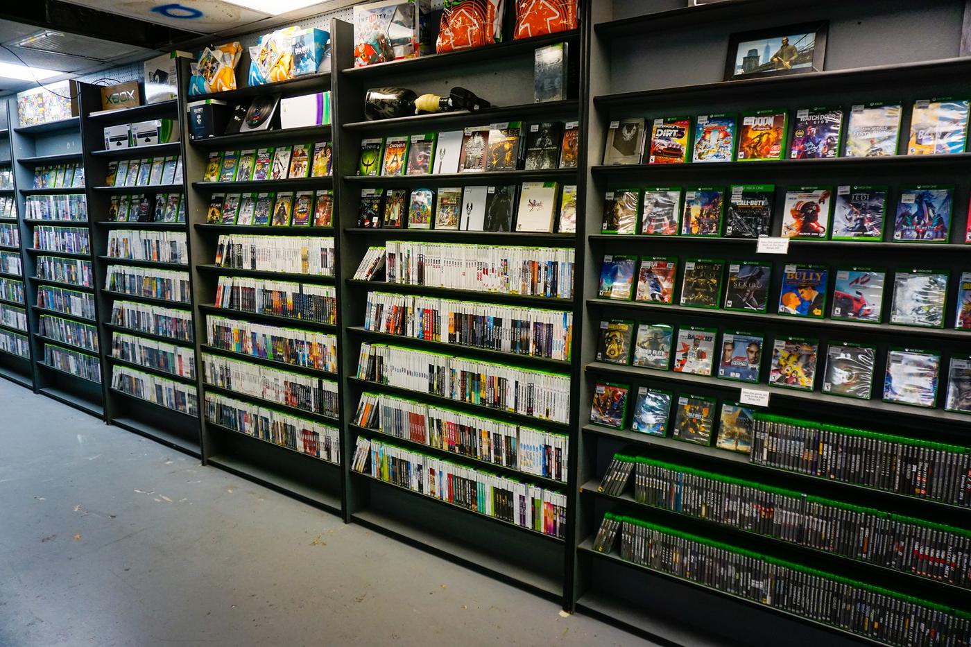 Black shelving packed with game cases